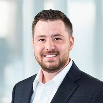 Professional businessman in a modern corporate office, representing business solutions and consulting services offered by Stagg Solutions.